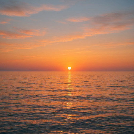 Beautiful sunset on the sea. The sun goes down over the ocean.