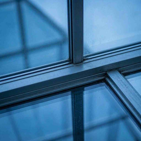 Glass windows in modern office building. Architectural background. Close-up.