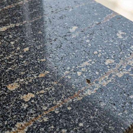 Close up detail of granite stone floor texture background with natural pattern.