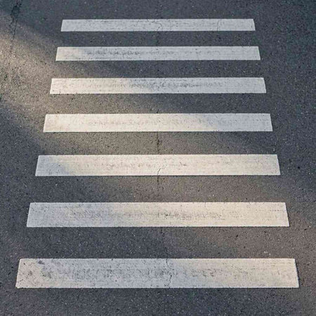 Crosswalk on the road with sunlight, zebra crossing in the city