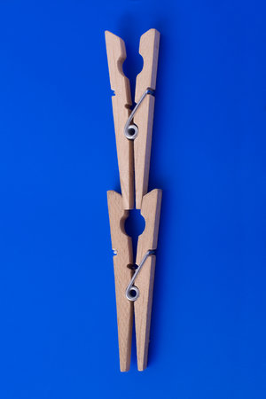 Two wooden clothes pegs