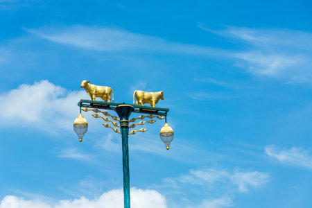 Street cow lamp with blue skyの写真素材