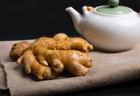 fresh ginger with tea pot