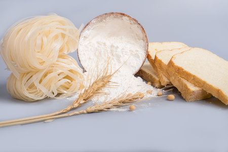 flour, bread and noodles on tableの写真素材