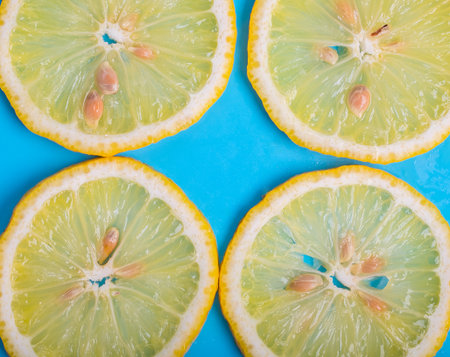 lemon slices on blue backgroundの写真素材
