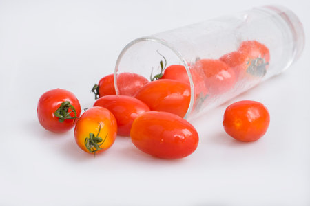 tomatoes in a glass of waterの写真素材