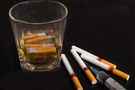 Cigarette butts in a cupの写真素材