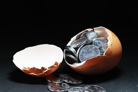 Eggs and coinsの写真素材