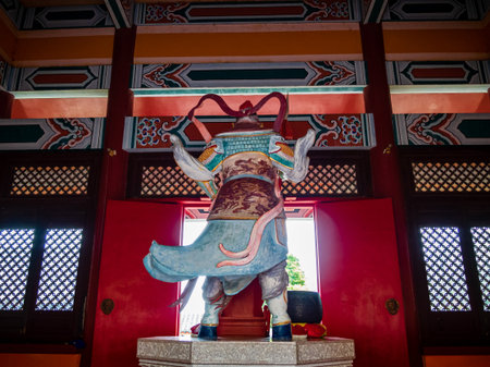 Back view of a Taoist diety, General Tian Peng, at a Taoist temple in Wen Bi Feng, Hainan, China.の写真素材