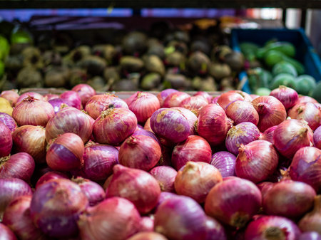 Close up of red onions at a grocery storeの写真素材