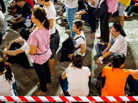SINGAPORE, 18 MAY 2019 - Devotees wait in queue to perform the three steps one bow ritual at Bright Hill temple (Kong Meng San Phor Kark See Monastery) on Vesak Day. The ritual is to purify the mind, humble the ego. and to express gratitude to Buddha.のeditorial素材