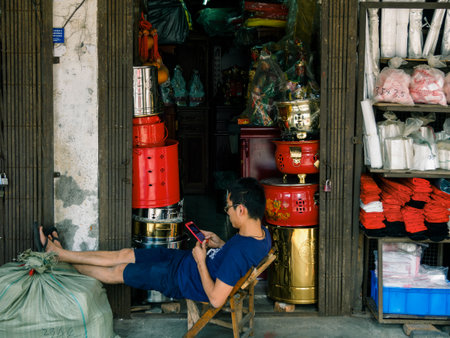 HAIKOU, HAINAN, CHINA - MAR 2 2019 â a shopkeeper of an old Chinese Taoist / Daoist / Buddhist prayer shop in Bo'ai Road, a famous historic street in Haikouのeditorial素材
