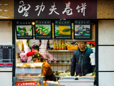 SHANGHAI, CHINA - 12 MAR 2019 - A small Chinese takeaway store in Shanghai serving hot pancakes, flatbread and grilled Taiwan sausages. Small business conceptのeditorial素材