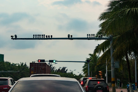 Speed monitoring surveillance cameras along a busy road in Haikou city, Hainan, China. China uses surveillance cameras extensively to enforce traffic rules.のeditorial素材