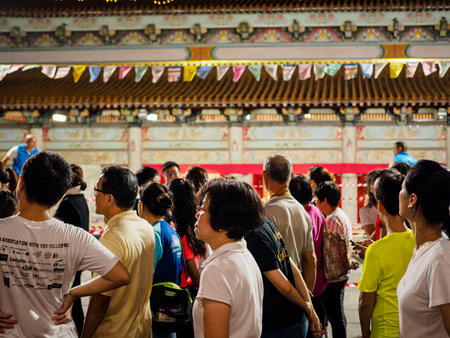 SINGAPORE, 18 MAY 2019 - Devotees queue to perform the three steps one bow ritual at Bright Hill temple (Kong Meng San Phor Kark See Monastery) on Vesak Day. The ritual is to purify the mind, humble the ego. and to express gratitude to Buddha.のeditorial素材