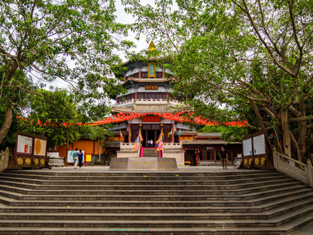 WEN BI FENG, HAINAN, CHINA - MAR 4 2019 â Low angle view of a Chinese pagoda temple at Wen Bi Feng park in Hainan, Chinaのeditorial素材