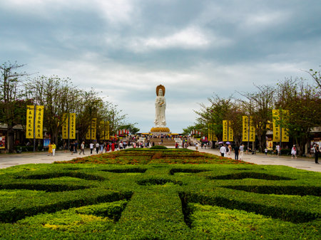 NANSHAN CULTURAL PARK, HAINAN, CHINA - 5 MAR 2019 â Wide angle view of the garden at Nanshan Buddhist Cultural Park / Temple, facing the famous statue of the Goddess of Mercy, Guanyin / Guan Yin / Kuan Yin / Kwan Yinのeditorial素材