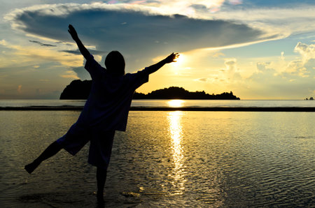 Women are happy to wait for sunrise の写真素材