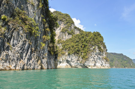 Beautiful mountain surrounded by water, Natural attractions in Ratchapapha dam at Surat Thani province, Guilin of Thailand の写真素材