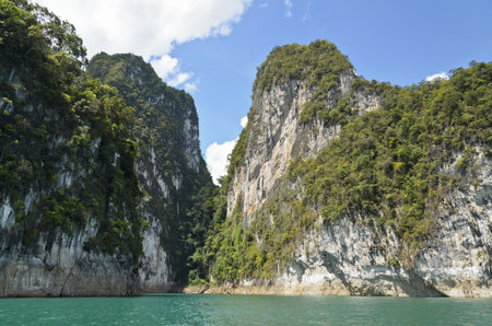 Beautiful mountain surrounded by water, Natural attractions in Ratchapapha dam at Surat Thani province, Guilin of Thailand の写真素材