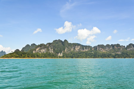 Beautiful mountain surrounded by water, Natural attractions in Ratchapapha dam at Surat Thani province, Guilin of Thailand  16 9の写真素材