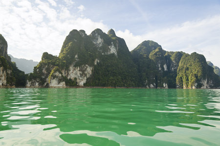 Beautiful high mountains and green river in the morning at Ratchaprapha Dam, Khao Sok National Park, Surat Thani Province, Thailand   Guilin of Thailand  の写真素材