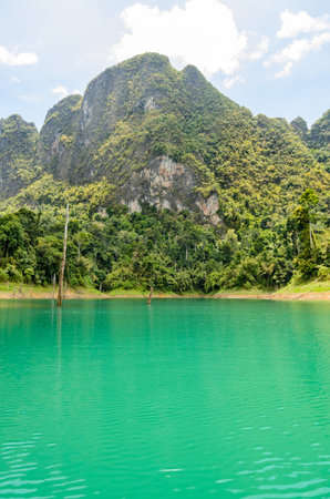 High mountain range above the green lake at Ratchapapha dam in Khao Sok National Park, Surat Thani province, Guilin of Thailand の写真素材