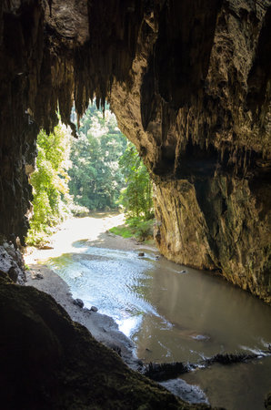 One side of entrance to a cave with stalagmite and stalactite at Tham Lod National Park, Mae Hong Son Province, Thailandの写真素材