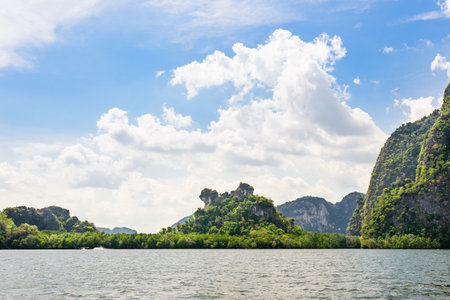 Khao Ma Chu island is scenic natural during a trip at the sea by a boat in Phang Nga Bay or Ao Phang Nga National Park Thailandの写真素材