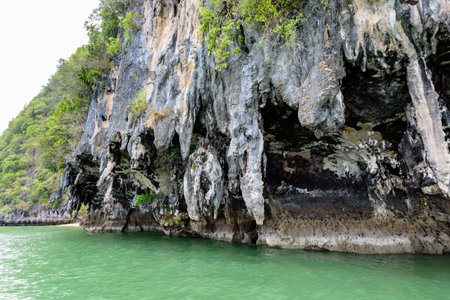 Exotic stone caves of the island by sea erosion for a long time in Ao Phang Nga Bay National Park Thailandの写真素材