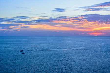 High angle view beautiful landscape of sunset over the Andaman sea from Laem Phromthep Cape scenic point is a famous attractions of Phuket Province in Thailandの写真素材