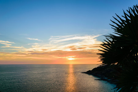 High angle view beautiful landscape of sunset over the Andaman sea from Laem Phromthep Cape scenic point is a famous attractions of Phuket Province in Thailandの写真素材
