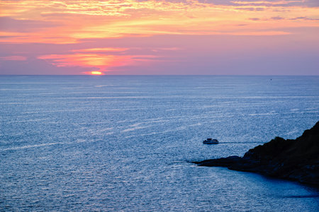 High angle view beautiful landscape of sunset over the Andaman sea from Laem Phromthep Cape scenic point is a famous attractions of Phuket Province in Thailandの写真素材