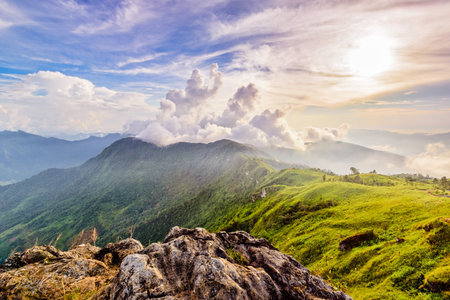 Beautiful landscape nature of high mountain cloud fog and sky on Phi Pan Nam Range during sunset in winter from viewpoint Phu Chi Fa Forest Park at Chiang Rai Province Thailandの写真素材