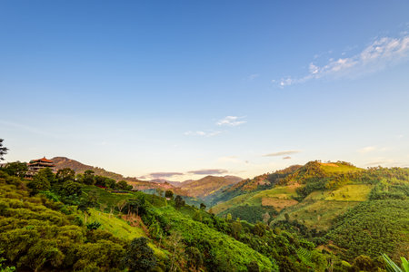 Beautiful natural landscape sky and sunlight in the morning atmosphere on the high mountain at Doi Mae Salong view point in Chiang Rai Province, Thailandの写真素材