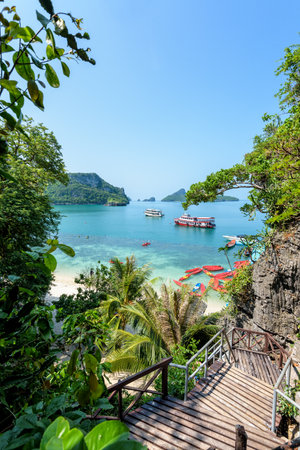 High view beautiful nature landscape of stairs up to the Thale Nai and travel boat on the sea in summer near the beach at Koh Mae Ko island in Mu Ko Ang Thong National Park, Surat Thani, Thailandの写真素材