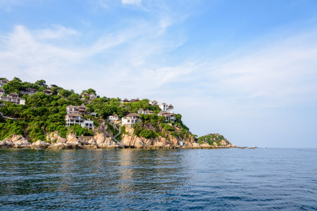 Beautiful nature landscape of villa on Shark Cape, Shark Bay area under the blue sky on the sea during summer at Ko Tao island is a famous tourist attractions in the Gulf of Thailand, Surat Thaniの写真素材