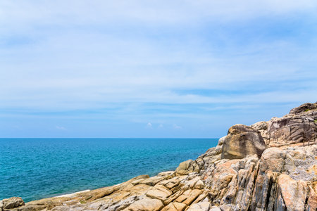 Beautiful natural landscape of rock along the coastline with blue sea under the summer sky at Koh Samui island, Surat Thani province, Thailandの写真素材