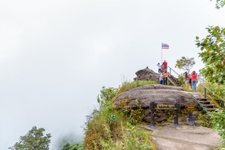 PHITSANULOK, THAILAND-OCT 23, 2018: Tourist groups on the top of the mountain, High view point to see the forest and fog at Pha Chu Thong attractions in Phu Hin Rong Kla National Park, OCT 23, 2018 in Thailandのeditorial素材