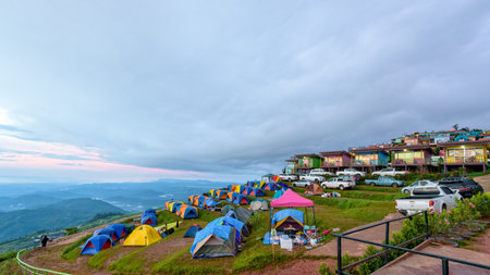 PHETCHABUN, THAILAND-OCT 24, 2018: Tourists, cars, tents and resorts on camping areas at Phu Thap Berk viewpoint surrounded by the beautiful nature of the mountain and forest during sunrise, OCT 24, 2018 in Thailandのeditorial素材