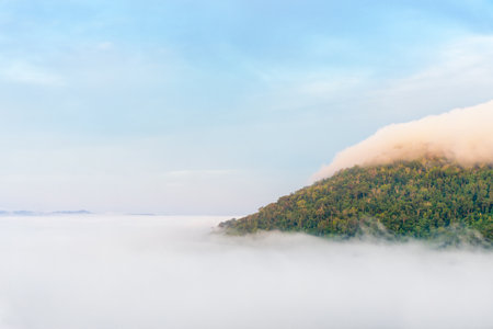 Beautiful nature landscape fog in the valley and the green mountain at the high angle viewpoint. Famous tourist attractions at Khao Kho district, Phetchabun province Thailandの写真素材