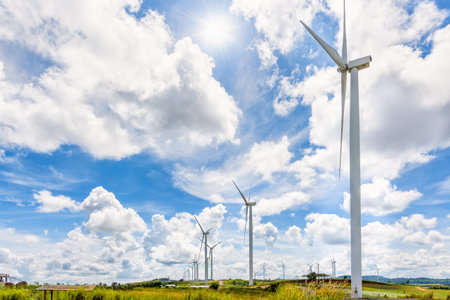 Beautiful landscape many windmills under the sun on blue sky and clouds background, Clean energy that is environmentally friendly at Khao Kho, Phetchabun, Thailandの写真素材