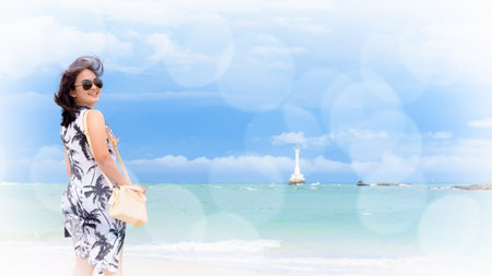 Beautiful woman tourist wearing sunglasse on the beach and sea in summer sky at Tarutao island, Satun, Thailand, add soft effect and texture bokeh for background, 16:9 widscreenの写真素材