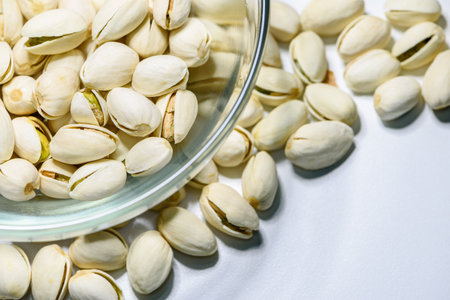 Close-up top view a pile of nut it has a white nutshell dry and hard of Pistachio, Pistache or Pistacia vera in a bowl food delicious salty snack copy space for backgroundの写真素材