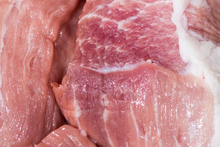 Closeup top view piece fresh raw meat of porkの写真素材
