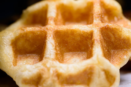Top view close up of fresh waffles delicious sweet. Making homemade food or dessert at homeの写真素材