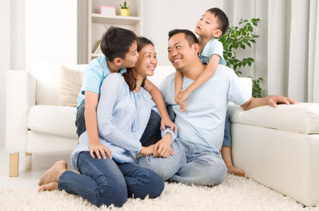Indoor portrait of asian mixed race familyの写真素材