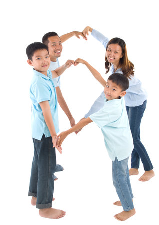 Asian family making heart shape with handsの写真素材