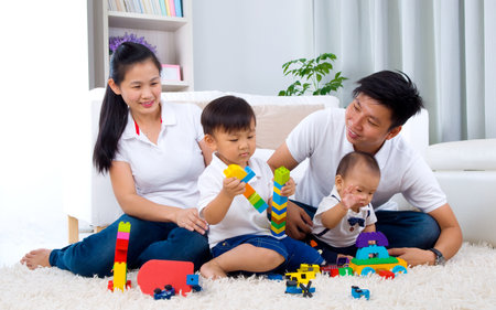 Asian family playing toysの写真素材