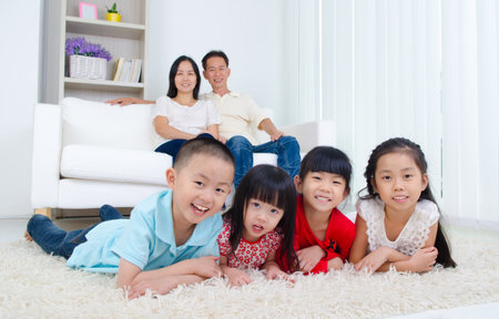 Asian family in the living roomの写真素材